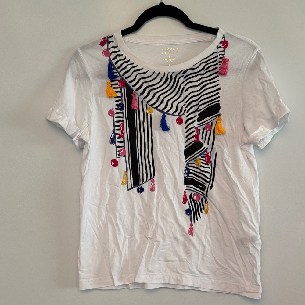 Kate Spade White Tee with Striped Pattern and Colorful Tassels